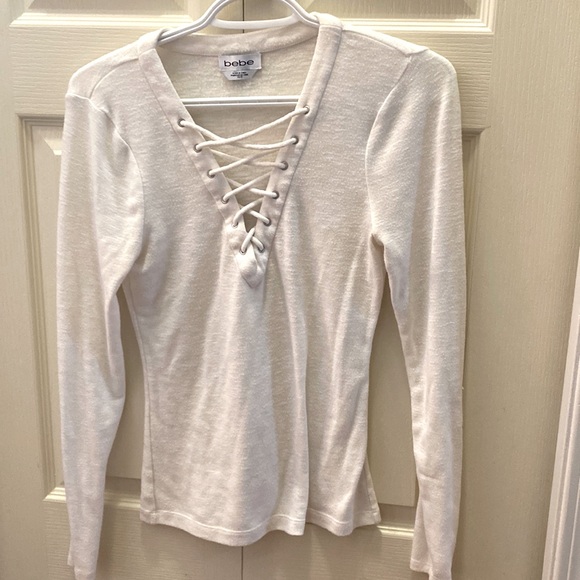 White long sleeved top. - Picture 1 of 4